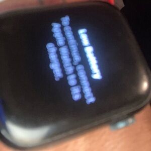 Black Smartwatch with Red and White Band
